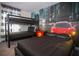 bedroom featuring a bunk bed, a full-size bed, and car-themed decor at 750 Pebble Beach Dr, Davenport, FL 33896
