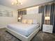 Bedroom featuring a neutral color scheme, stylish lamps, and decorative pillows at 750 Pebble Beach Dr, Davenport, FL 33896