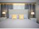 Bedroom featuring a neutral color scheme, stylish lamps, and decorative pillows at 750 Pebble Beach Dr, Davenport, FL 33896