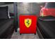 Close up of a Ferrari-themed nightstand in a bedroom featuring a cityscape mural at 750 Pebble Beach Dr, Davenport, FL 33896