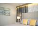 Bedroom featuring a neutral color scheme, stylish lamps, and decorative pillows at 750 Pebble Beach Dr, Davenport, FL 33896