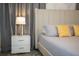 Bedroom featuring a neutral color scheme, stylish lamps, and decorative pillows at 750 Pebble Beach Dr, Davenport, FL 33896