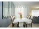 Dining room with a white tabletop and upholstered chairs at 750 Pebble Beach Dr, Davenport, FL 33896