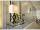 Contemporary entryway featuring an acrylic console table with glass top at 750 Pebble Beach Dr, Davenport, FL 33896