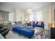 Well-lit living room with cozy seating and a modern aesthetic at 750 Pebble Beach Dr, Davenport, FL 33896