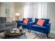 Bright living room featuring modern furniture, area rug and natural light through large windows at 750 Pebble Beach Dr, Davenport, FL 33896