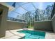 Inviting pool in screened enclosure features comfortable lounge chairs for relaxation at 750 Pebble Beach Dr, Davenport, FL 33896