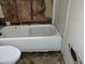 Bathroom in disrepair, showing damage to the walls and floor at 800 Nicole Blvd, Ocoee, FL 34761