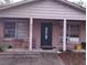 Modest home exterior with a covered front porch and some outdoor seating at 800 Nicole Blvd, Ocoee, FL 34761