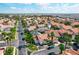 Neighborhood with terra cotta roofs and screened pools surrounded by palm trees and lush landscaping at 802 Brunello Dr, Davenport, FL 33897
