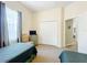 Inviting bedroom with twin beds, a closet, and soft, neutral colors, providing a relaxing space at 802 Brunello Dr, Davenport, FL 33897