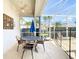 Screened lanai features an outdoor dining area and a partial view of the backyard at 802 Brunello Dr, Davenport, FL 33897