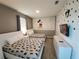 Whimsical bedroom featuring Mickey Mouse wall decor, two beds, and a TV for fun and relaxation at 8885 Cabot Cliffs Dr # 103, Davenport, FL 33896