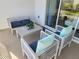 Screened-in patio with outdoor furniture, comfortable seating and coffee table at 8885 Cabot Cliffs Dr # 103, Davenport, FL 33896
