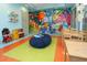 Colorful room with whimsical decor, toys, and a cozy beanbag chair, perfect for play and creativity at 8885 Cabot Cliffs Dr # 103, Davenport, FL 33896