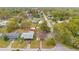 Neighborhood aerial showcasing the property's location in a tree-lined community at 900 Delaware Ave, St Cloud, FL 34769