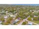 Spacious neighborhood with homes and tree lined streets near a body of water at 900 Delaware Ave, St Cloud, FL 34769