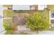 Birds eye view of house showcasing roof, patio, and landscaping in a cozy neighborhood at 900 Delaware Ave, St Cloud, FL 34769