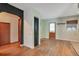 Hallway with hardwood floors, closet, and doorway with arch at 900 Delaware Ave, St Cloud, FL 34769