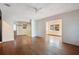 Bright living room boasting beautiful hardwood floors and fresh, neutral paint at 900 Delaware Ave, St Cloud, FL 34769