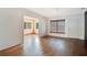 Cozy living room with hardwood flooring and a view into the next room at 900 Delaware Ave, St Cloud, FL 34769