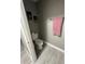 Half bathroom featuring toilet, neutral walls and laminate floors at 920 Gillingham Ct, Kissimmee, FL 34758