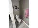 Half bathroom featuring toilet, neutral walls and laminate floors at 920 Gillingham Ct, Kissimmee, FL 34758