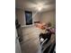 This bedroom features new light wood-look flooring, a ceiling fan, and a black-out curtain at 920 Gillingham Ct, Kissimmee, FL 34758