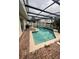 Screened-in pool area featuring a pool with brick pavers at 920 Gillingham Ct, Kissimmee, FL 34758