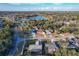 Aerial view of houses in a neighborhood, highlighting nearby lake at 9404 Montello Dr, Orlando, FL 32817