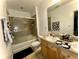 Bathroom with shower-tub combo, neutral tile, and modern vanity at 11446 Jasper Kay Ter # 106, Windermere, FL 34786