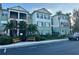 Well-maintained condo building with landscaping, a black iron fence, and reserved parking spots at 11446 Jasper Kay Ter # 106, Windermere, FL 34786