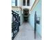 Hallway view with black iron fencing, and a fire riser sign at 11446 Jasper Kay Ter # 106, Windermere, FL 34786
