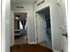 Hallway with open doors leading into two separate bedrooms at 11446 Jasper Kay Ter # 106, Windermere, FL 34786