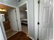 Inviting hallway view showcases bedroom and bathroom with neutral walls and modern tile flooring at 11446 Jasper Kay Ter # 106, Windermere, FL 34786