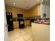 Functional kitchen equipped with essential appliances and ample cabinet space at 11446 Jasper Kay Ter # 106, Windermere, FL 34786