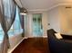 Comfortable living room boasts stylish furniture, large windows, and sliding doors leading to the patio at 11446 Jasper Kay Ter # 106, Windermere, FL 34786