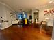 Spacious living room featuring hardwood floors, ceiling fan and comfortable seating at 11446 Jasper Kay Ter # 106, Windermere, FL 34786