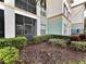 Enclosed patio with adjacent screened porch, and lush landscaping at 11446 Jasper Kay Ter # 106, Windermere, FL 34786