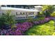 Lakeside at Lakes of W ndermere community entrance with a beautiful sign surrounded by colorful flowers at 11446 Jasper Kay Ter # 106, Windermere, FL 34786