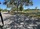 Street view with mature trees, providing a peaceful and scenic environment at 11446 Jasper Kay Ter # 106, Windermere, FL 34786