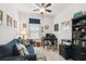 Versatile room featuring a sofa, desk, bookcase, and neutral walls, perfect for work or relaxation at 1398 Del Mar Dr, Kissimmee, FL 34759