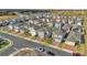Aerial view of a residential neighborhood with modern homes, manicured lawns, and well-planned street layout at 1669 Swan Swim Dr, Davenport, FL 33837
