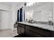This bathroom features double sinks with granite countertops and under-mount storage at 1669 Swan Swim Dr, Davenport, FL 33837