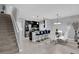 Modern kitchen with stainless steel appliances, island with breakfast bar, and stylish dining area with a modern chandelier at 1669 Swan Swim Dr, Davenport, FL 33837