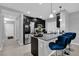 Modern kitchen with granite countertops, dark wood cabinets, stainless steel appliances, and bar seating at 1669 Swan Swim Dr, Davenport, FL 33837