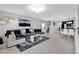 Spacious living room with open floor plan, tile floors, and a view of the dining area and kitchen at 1669 Swan Swim Dr, Davenport, FL 33837