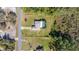 Aerial view of a single-Gathering home featuring a well-manicured lawn and screened-in pool at 1741 Eldorado Ct, St Cloud, FL 34771