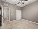 Bedroom featuring a ceiling fan, carpet flooring, a double door closet and a door to the outside at 1741 Eldorado Ct, St Cloud, FL 34771