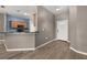Inviting entryway featuring wood-look tile flooring and a white front door, leading to the kitchen at 1741 Eldorado Ct, St Cloud, FL 34771